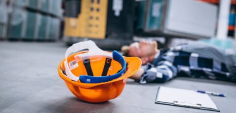 An accident at a warehouse, man on floor